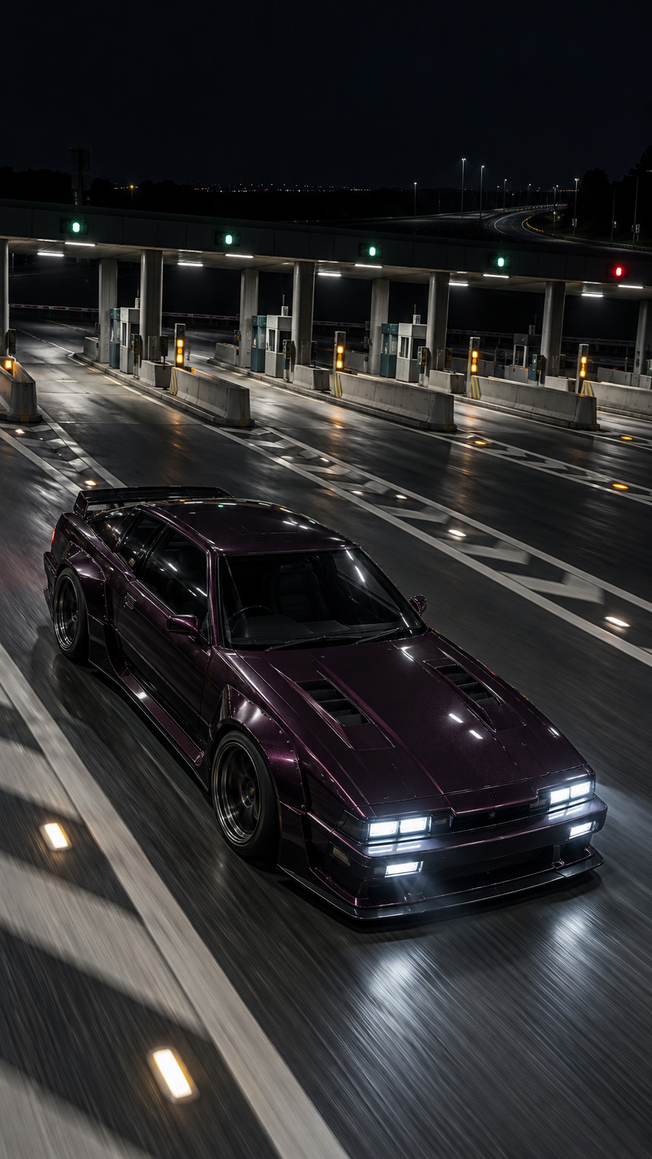 An unbranded dark plum Japanese tuner liftback accelerates through an empty expressway toll plaza at night, seen from a steep elevated front-quarter angle with white headlights illuminating marked asphalt.